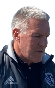 Sporting KC manager speaks while talking to the media after practice.